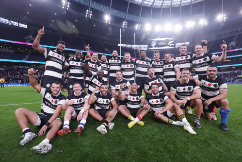 Players from the Barbarians rugby team celebrate beating an All-Blacks fifteen at Tottenham Hotspur Stadium